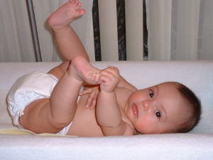 baby playing with toes